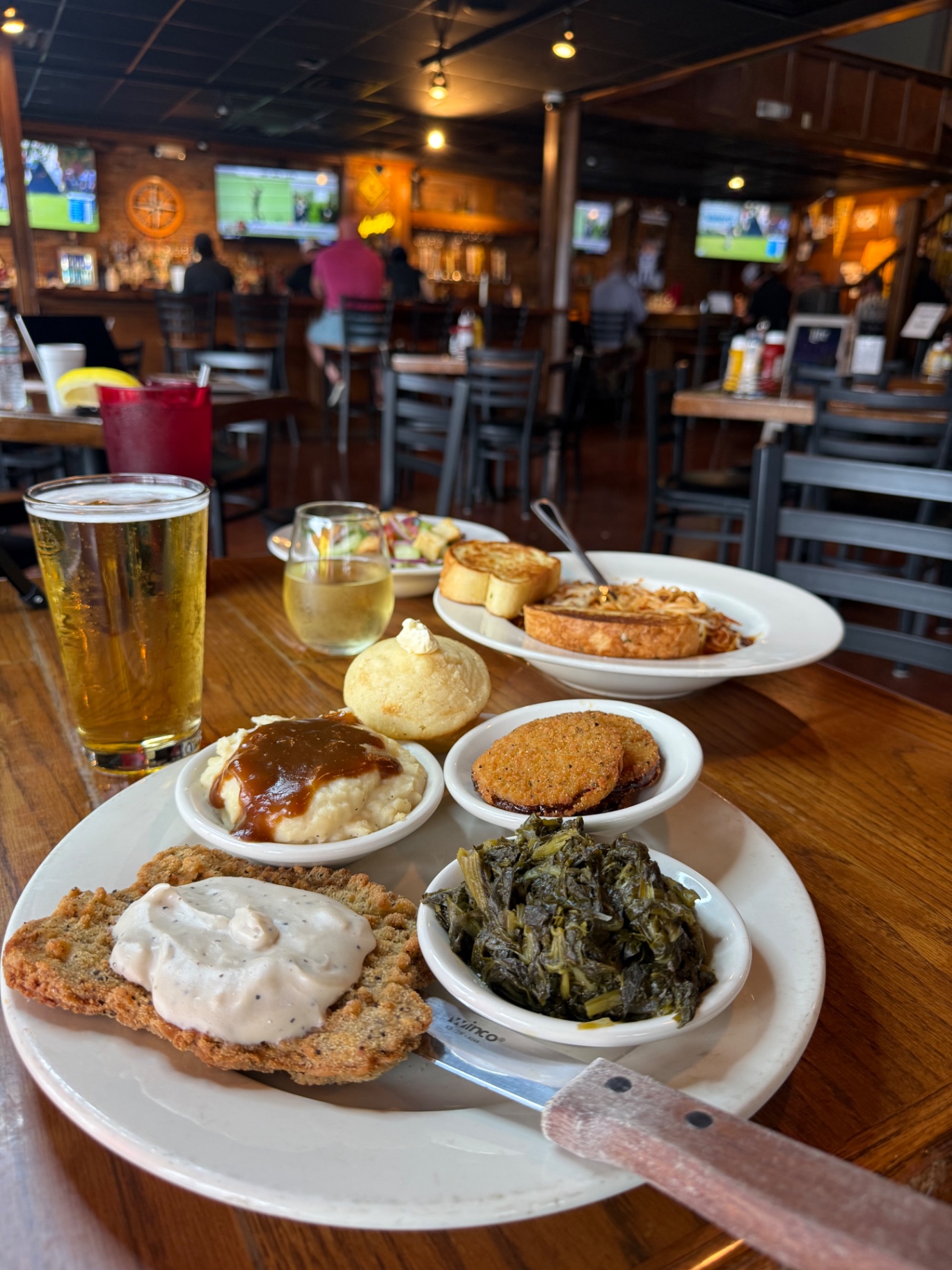 Crow's Nest country-fried steak meat and three with mashed potatoes, greens and fried green tomatoes