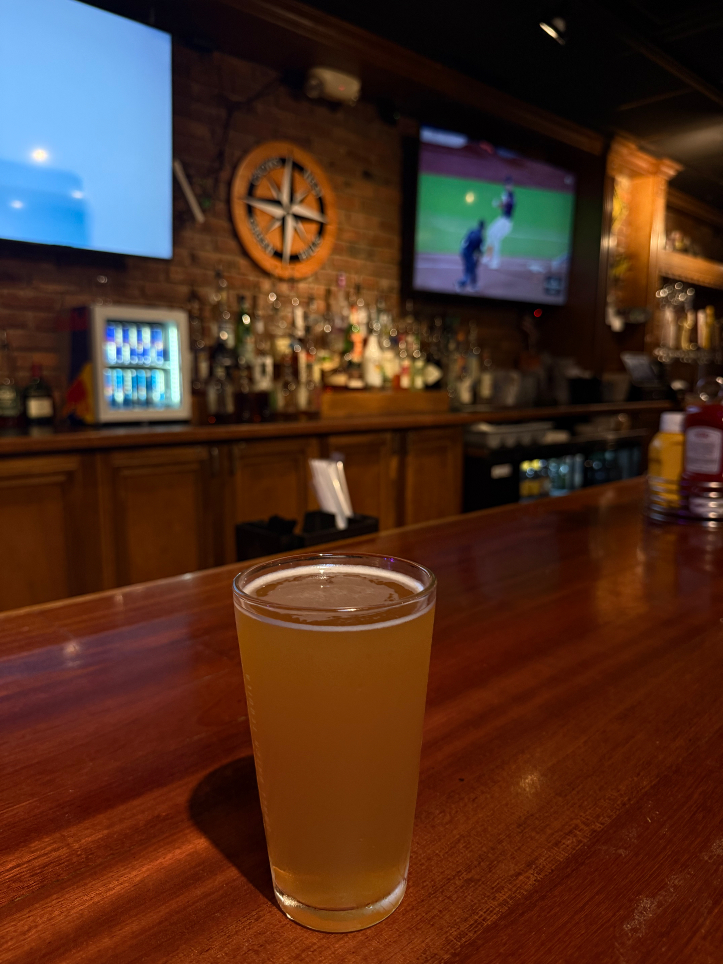 Cold draft beer on the Crow's Nest bar with the game on